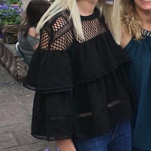 Black flow he blouse with crocheted shoulders